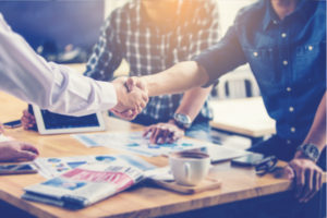 People at a business meeting shaking hands