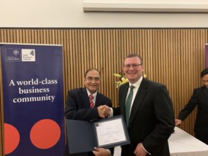 David Smith receiving an award from Lalit Johri