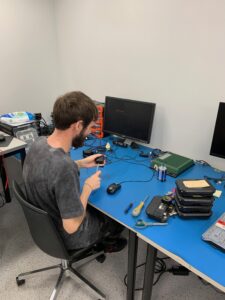 Nick working at Seeing Machines with computer equipment