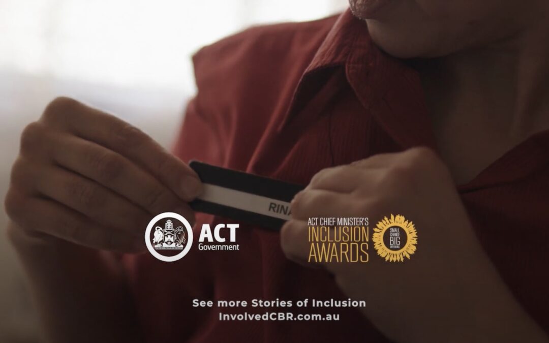 Image of woman putting on a name tag